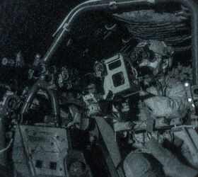 A U.S. Marine assigned to Reconnaissance Company, 15th Marine Expeditionary Unit, holds security in a Polaris MRZR during a raid.