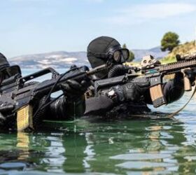 A member of the Croatian Zapovjednistvo Specialjalnih Snaga (ZSS) and a member of U.S. Naval Special Warfare Task Unit Europe (NSWTU-E) conduct an over the beach (OTB) exercise in Split, Croatia, April 15, 2022. For the Croatian ZSS, Joint Combined Exchange Training, or JCET with partner nations is not uncommon. The ZSS were founded in 2000 as the Special Operations Battalion and since then, its operators have participated in multiple operations, including stints in Afghanistan as part of NATO's International Security Assistance Force (ISAF). (U.S. Army photo by Sgt. Patrik Orcutt)