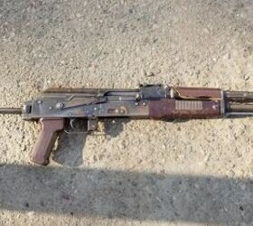 Typical workhorse East German AK with rust and chipped handguard.