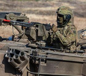 An Australian Defense Force Soldier (ADF) mans an M240 Bravo machine gun during Exercise Super Garuda Shield on 5th Marine Training Center (Puslatpu), Situbondo Regency, East Java, Indonesia.