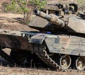 An Australian Defense Force (ADF) M1A1 Abrams tank maneuvers across the battlefield to engage the opposing force.