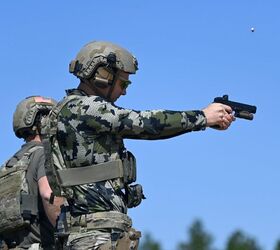 potd usasoc international sniper competition, A competitor in the United States Army Special Operations Command International Sniper Competition fires a pistol U S Army photo by K Kassens