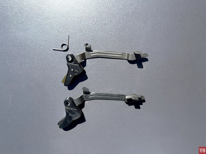 Shown is the left side profile of the Timney trigger shoe and bar, and Glock shoe and bar. Carbon has been wiped off. Timney trigger return spring shown.