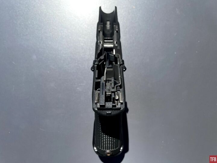 Stock Glock trigger components installed in a Glock 19 frame.