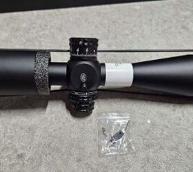 DNT Optics includes a throw lever, and a little sticker on the bottom of the scope that says Made in China