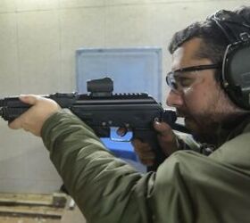 Author, shooting SMG with prototype suppressor