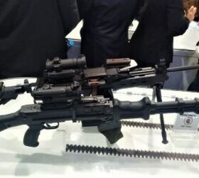 vietnam defence expo 2024 negev machinegun chambered for 7 62x39, Comparison of the new Negev and the old LMG it is replacing the STrL D front with the latest modification of the RPD with plastic parts and Picatinny rail Photo by V ng H i