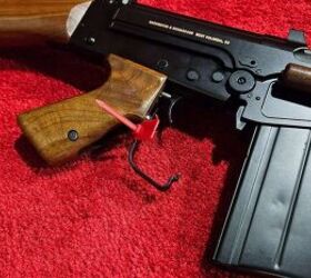 The trigger guard opens for use with winter gloves.