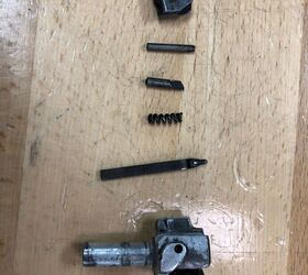 the last nail in the coffin of soviet small arms the an 94, AN 94 disassembled bolt Photo by Lynndon Schooler