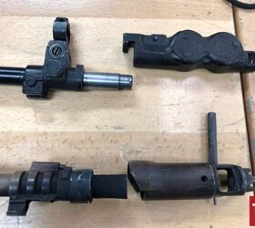 the last nail in the coffin of soviet small arms the an 94, AN 94 and the carbon caked AK 12 some ideas don t die off but carry on into different projects Photo by Lynndon Schooler