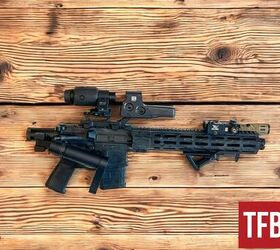 truck guns part 1 from stagecoaches to tacomas, Midwest Industry AR15 with a 10 5 barrel Midwest Industry inline comp and DeadFoot Arms folding system The platform can be fired while folded