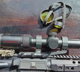 tfb review winchester supreme 1 4x24mm lvpo rifle scope, The Winchester Supreme 1 4x24mm Rifle Scope comes with a set of clear lens covers joined by two rubber straps