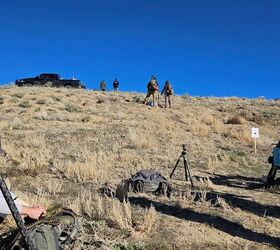 Waiting for our turn to shoot a stage. The ROs are visible on the ridgeline, and the shooters on deck are partway up the hill.