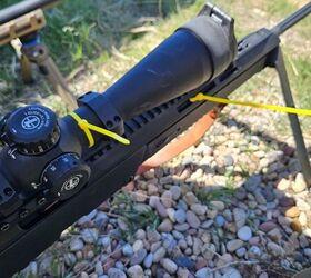 Those yellow zip ties show that the gun and scope passed weigh-in and are legal for use.