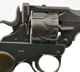 wheelgun wednesday auto or revolver why not both, Those unusual striations on the cylinder used the gun s recoil to rotate a fresh cartridge into battery Joe Salter