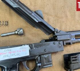 yugoslavias compact 9mm submachine gun the zastava master flg, Master FLG short stroke piston assembly on the right side of the top cover hinge assembly By Lynndon Schooler