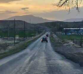 Line of competitors driving out to the range, early Sunday morning