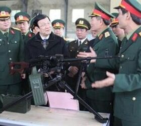 vietnam s pkm the dl7n general purpose machine gun, Military officials inspecting the DL7N production wood stock and standard bipod Photo Credit Unknown