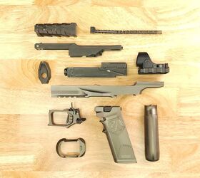 the quest for the low bore axis rideout arsenal dragon from the usa, The Dragon fully disassembled from top left bolt carrier recoil spring bolt nose barrel and N ROC with Trijicon SRO then the frame elements