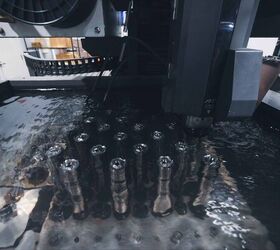 Cans being cut with EDM (electro-discharge machining)