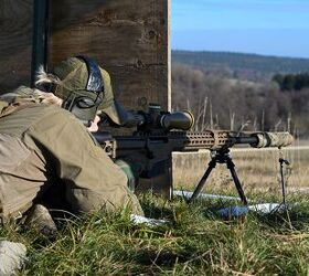 potd snipers at the european best sniper team competition, A Norwegian sniper engages targets with his Barrett MRAD Note the Schmidt Bender rifle scope