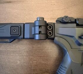 Side view of the stock, note the easy access button for both folding and extending/retracting the stock.