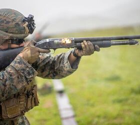 potd mossbergs military shotgun in full flash