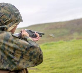 potd mossbergs military shotgun in full flash