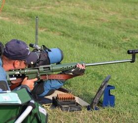 Match rifle with iron sights. Note that the shooting sling is supporting the gun rather than a bipod or rest.