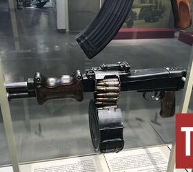 the rpd soviet unions first squad automatic weapon, RPD and its 100 round ammunition canister Two 50 round belts are linked together By Lynndon Schooler