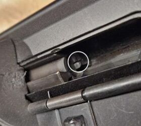 The ejector (marked in the white circle) should sit close to the cutout in the bolt above it. This particular gun had a significant gap, and once it was repositioned the gun became reliable.