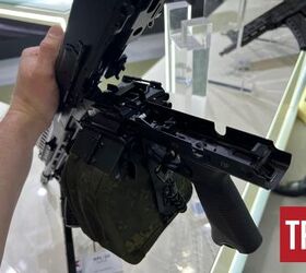 inside russia s rpl 20 machine gun, Open feed tray cover of the bottom feeder By Lynndon Schooler