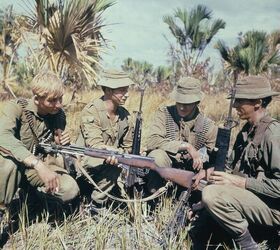 fudd friday why you want an sks for hunting and why you don t, Australian soldiers look at a captured SKS during the Vietnam War After the Cold War ended the American market was flooded with surplus SKS rifles from China and Europe