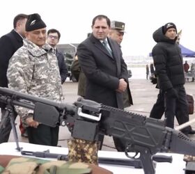 Officials inspecting the new MMG. Photo credit unknown.