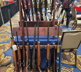 rimfires that deserve a reboot, At this gun show you can see a Remington Model 12 in the middle of the gun rack turned sideways I d be just as happy to see this or a Savage Model 29 come back maybe with slight changes to make manufacturing easier
