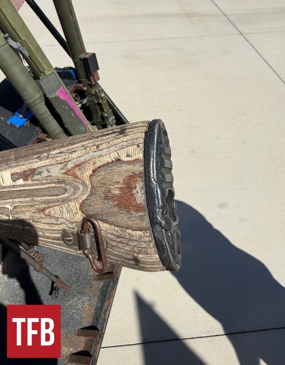 Early rubber buttpad that was quickly replaced with a steel bullet plate.