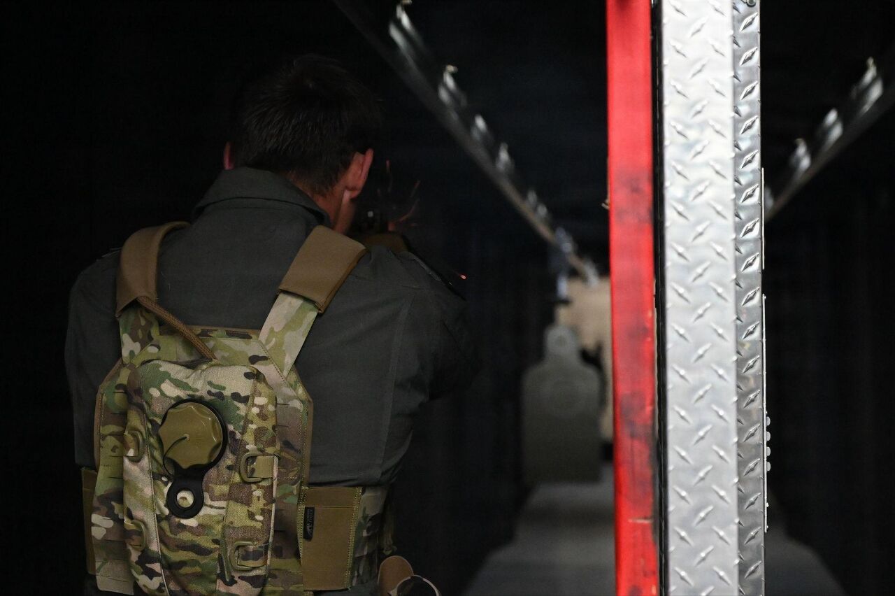 U.S. Air Force Maj. Cole Temmen, a C-130 pilot assigned to the 129th Rescue Wing, shoots a M18 pistol with an attached isolated personnel lethality optimization (IPLO) device, during a proof of concept event, at Hawaii Air National Guard Base, on April 21, 2026. Temmen's shooting accuracy, precision, speed improved with using the conversion kit. (U.S. Air National Guard photo by Staff Sgt. Serena Smith)